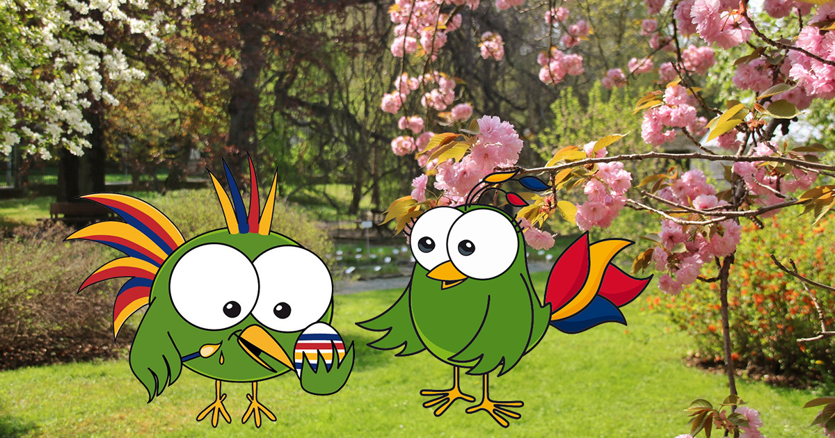 Foto mit Kirschblüten im Botanischen Garten Jena, darauf zwei Comicfiguren: Paradiesvögel beim Ostereier färben