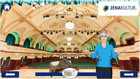 Ein Screenshot aus dem digitalen Programm zu BGM: Zu sehen der Ernst-Abbe-Saal im Volkshaus mit einer gezeichneten Frau mit grauen Haaren und Brille. Sie erklärt etwas.